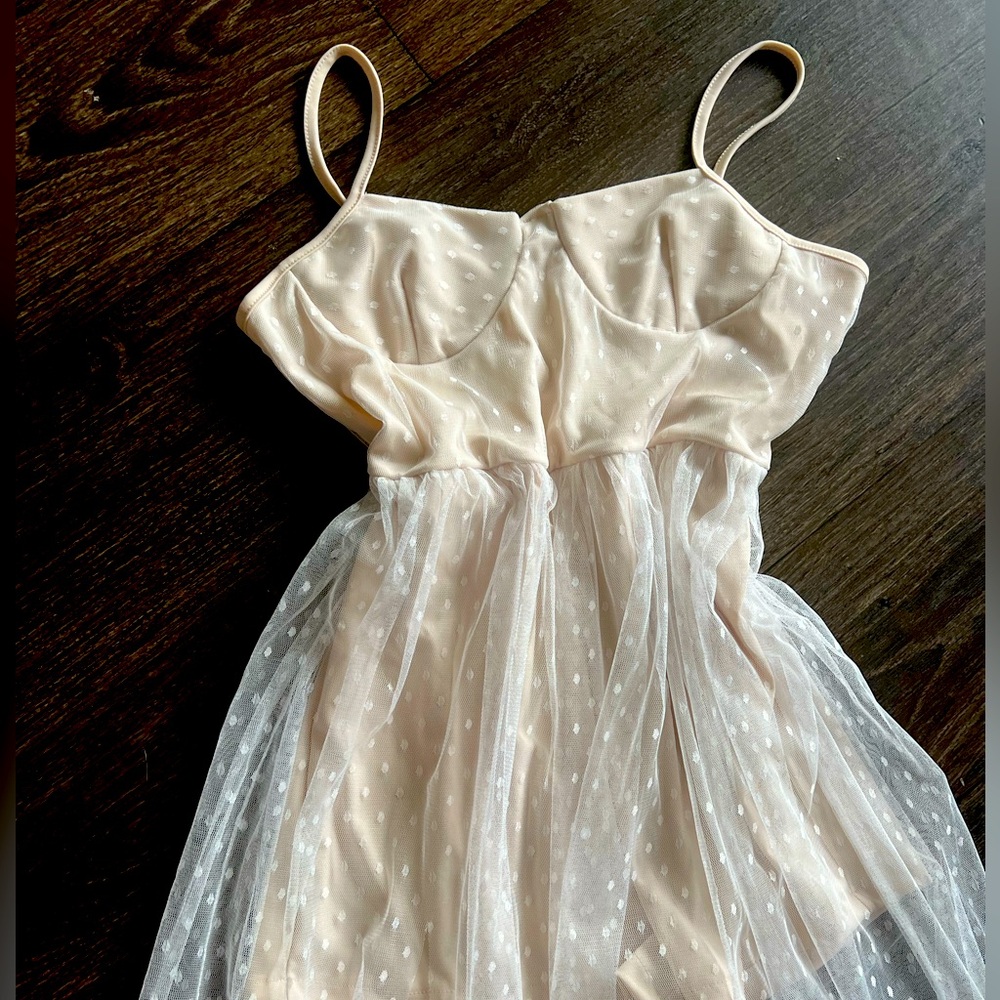 New Cream colored corset dress with see through skirt. Never worn